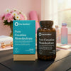 One Nutrition Pure Creatine Monohydrate supplement packaging on a table with a pink background